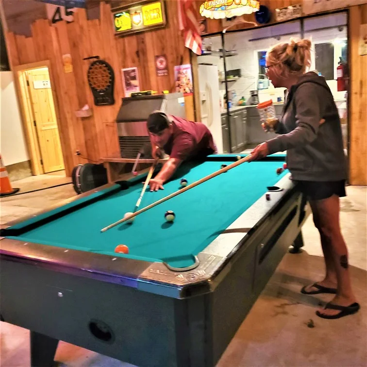 people playing a game of pool